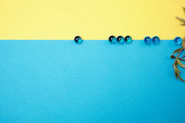 Glass beads on a colored paper background. Place for text