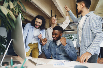 Happy overjoyed business team celebrate corporate victory