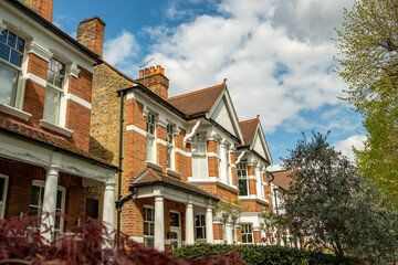 Fototapeta na wymiar Row of typical upmarket British red brick period houses in west London