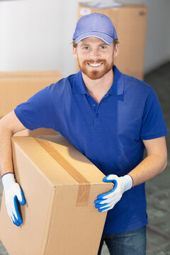 home delivery service - deliveryman with box standing