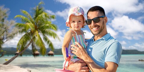 family, fatherhood and travel concept - happy smiling father with little daughter over tropical...