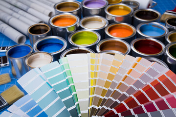 Open paint cans with a brush, Rainbow colors