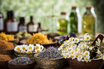 Natural remedy and mortar, healing herbs background