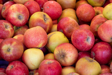 Fresh red apples in the market. Red apples in bulk. ripe red apples in a street market