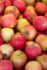Fresh red apples in the market. Red apples in bulk. ripe red apples in a street market