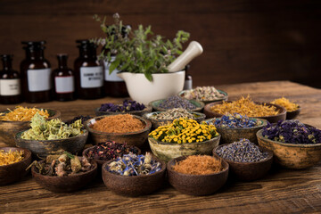 Natural medicine and mortar, healing herbs background