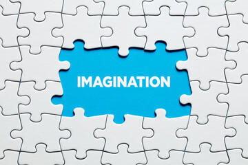 The word imagination surrounded by jigsaw puzzle. To increase or improve creativity and imagination...