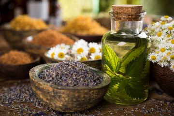 Natural remedy and mortar, healing herbs background
