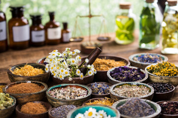 Natural remedy and wooden table background
