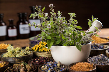 Natural remedy, mortar and herbs