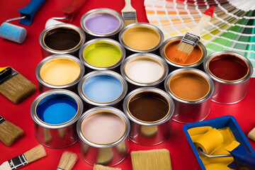 Colorful paint cans with paintbrush
