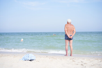 Alone unrecognizable senior man standing sea beach Sadness loneliness ageing solitude aged - Powered by Adobe