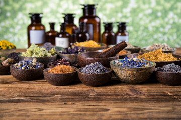 Fototapeta na wymiar Natural medicine and mortar, healing herbs background