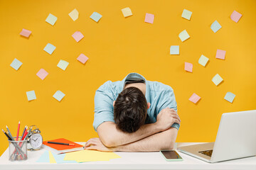 Young sad tired exhausted frustrated sick ill sleepy employee business man wear shirt sit work at...