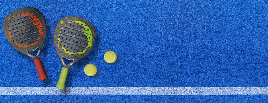 Close up of a padel ball and rackets on a blue syntehtic playground	