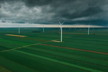 Aerial view of wind turbines on renewable green energy wind farm