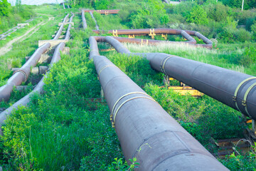 sewer pipes on a hillside draining waste into the river