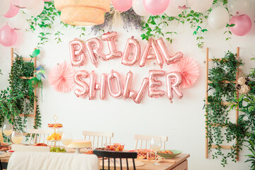 Decorated with balloons and ribbons bridal party room.