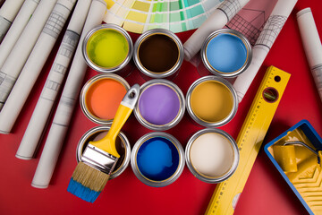 Metal tin cans with color paint and paintbrush - Powered by Adobe