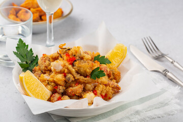 Sea lunch:  fried seafood - “Fritto misto di mare” (prawns, squid, fish fillets served with caviar and lemon), fried potatoes, water and white wine.