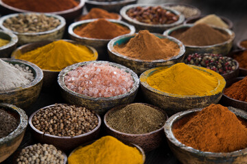 Spices on wooden bowl background