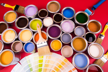 Tin cans with paint and brushes