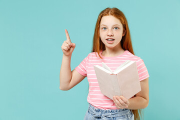 Little insighted fun redhead kid girl 12-13 year old in pink striped tshirt hold book point index...