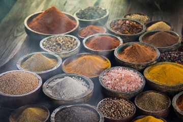 Colorful spices in bowl background