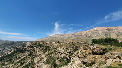 Beautiful village near the valley. Aerial image of the city and valley. Best hiking trails. Middle East country. Summer vacation in Lebanon. Travel trip.