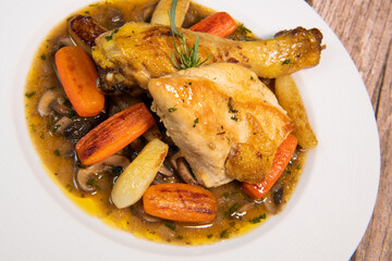 Chicken Hunter recipe with glazed root vegetables, carrot, turnip with its mushroom sauce deglazed in white wine and wet with the chicken stock