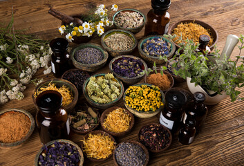Natural remedy and mortar, healing herbs background