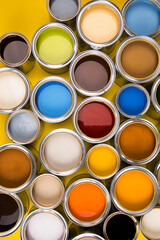 Buckets full of rainbow colored oil paint