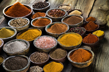 Aromatic spices on wooden background