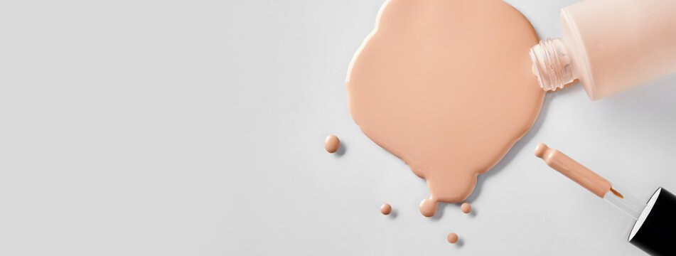 Banner with Mockup glass bottle of correction cosmetic product with pipette. Spilled Liquid foundation. Beauty branding concept