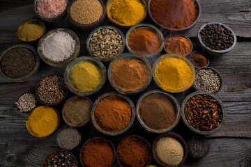 Spices and herbs selection on wooden background