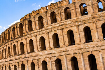 Obraz premium Ruins of the largest coliseum in North Africa. Demolished ancient walls Roman amphitheatre at El Djem, Tunisia, Nord Africa