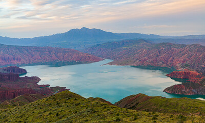 Landscape in the blue hour after sunset with arid badlands and the Yellow river in Kanbula national...