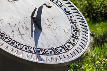 Sundial in the park. Old clock.