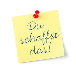 Yellow paper note with text  You can do it in german - Du schaffst das