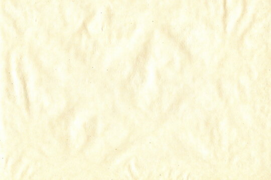 The Texture Of Uneven Yellow Parchment Paper. Abstract Monochrome Nice Simple Background.