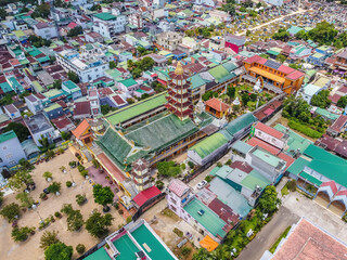 Aerial view of ancient Phuoc Hue pagoda on summer's day in Bao Loc, Vietnam, peaceful small town located on the plateau Di Linh, Lam Dong province