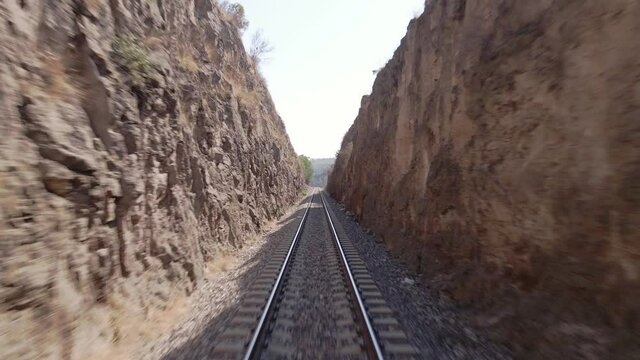 train tracks alone in the mountains