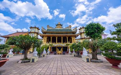 Fototapeta premium beautiful view of ancient Phuoc Hue pagoda on summer's day in Bao Loc, Vietnam, peaceful small town located on the plateau Di Linh, Lam Dong province.