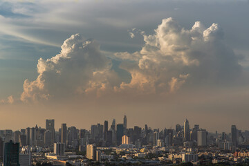Fototapeta premium Bangkok, Thailand - May 09, 2021 : Aerial view of Beautiful scenery view of Skyscraper Evening time before Sunset creates relaxing feeling for the rest of the day. Selective focus.