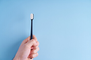 Fashionable toothbrush with soft bristles. Popular toothbrush. Hygiene trends