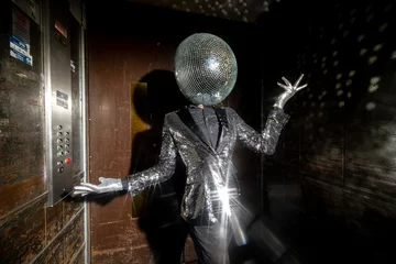 Fotobehang Mr disco ball dancing in a lift © Dan Talson