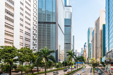 Fototapeta na wymiar Business district of Hong Kong City, street traffic and modern skyscraper buildings