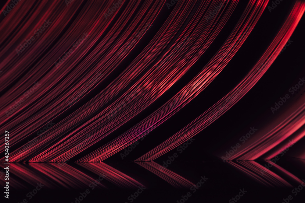 Aufkleber Close up Beautiful book pages in the red light on a night. Background pattern for design. Macro photography view.