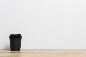 A black coffee cup on table. 