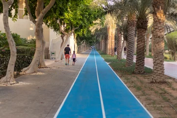 Tuinposter Dubai, UAE - 05.15.2021 - Jogging and cycling tracks at Al Ittihad park in Palm Jumeirah. Outdoors © Four_Lakes